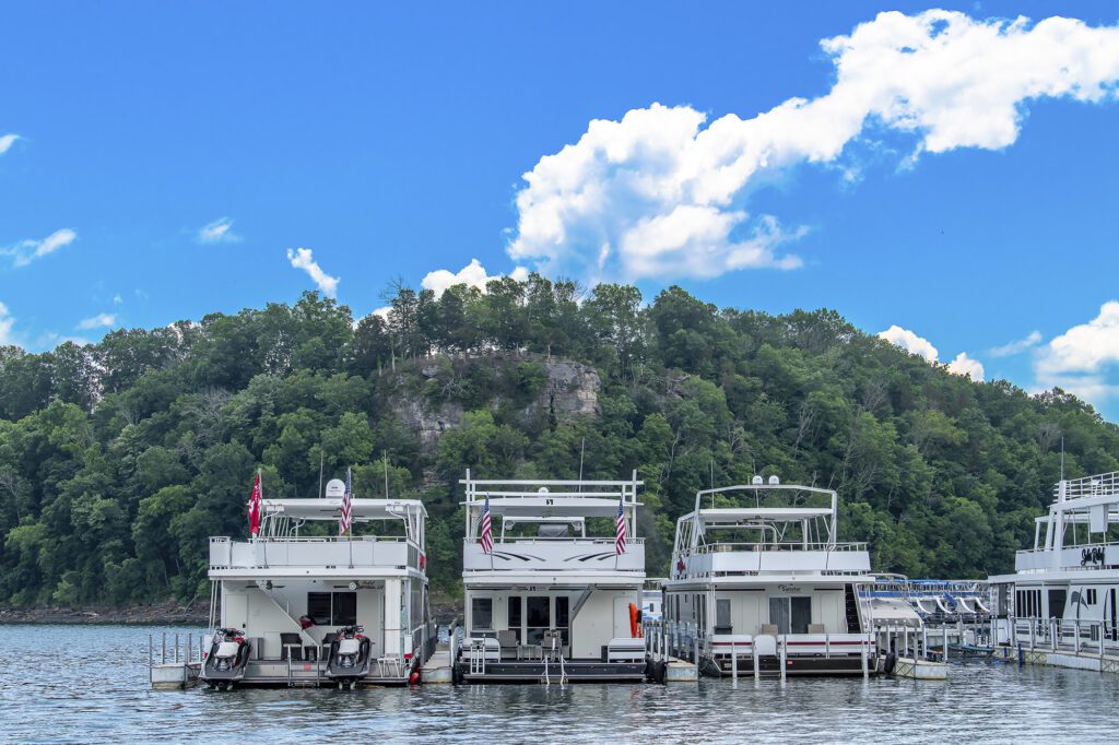three houseboats on the water